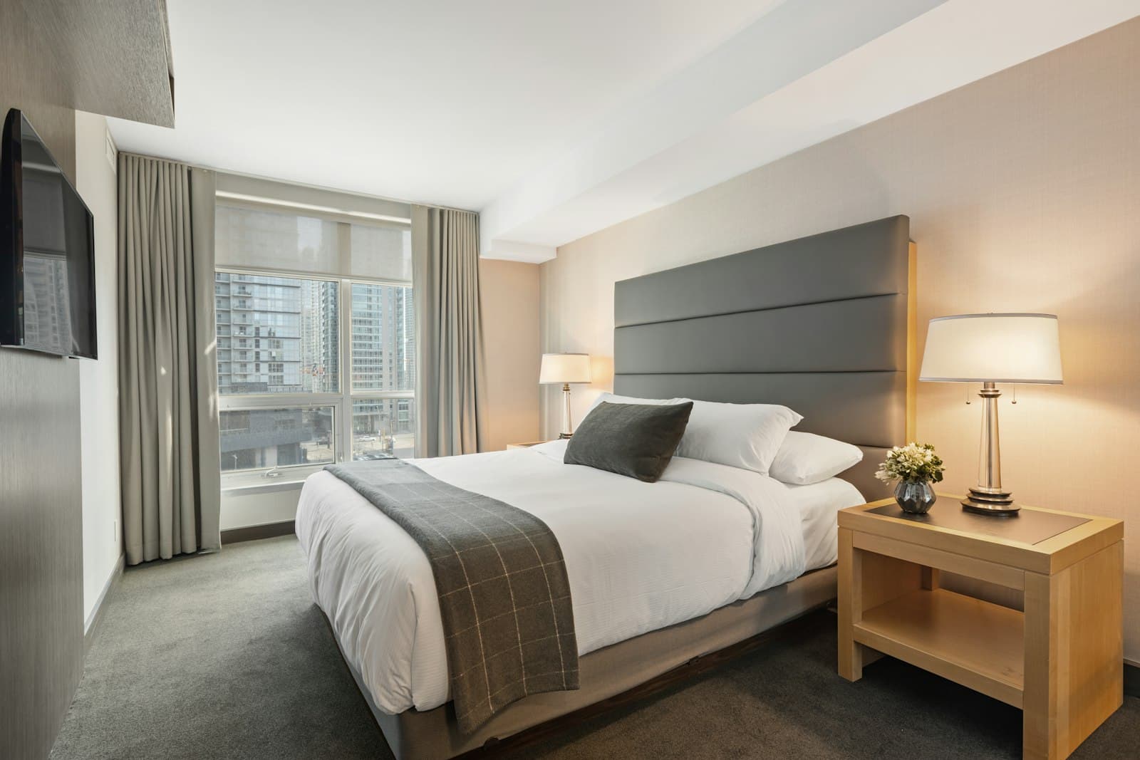 Guest bedroom with calm neutrals and layered bedding