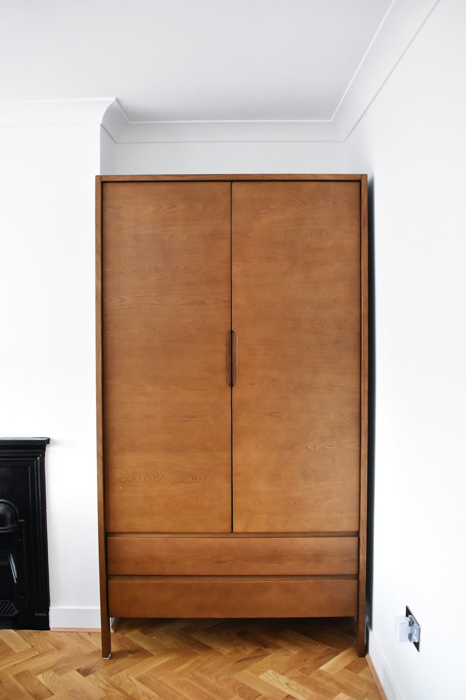 Custom walk-in closet with center island and warm lighting